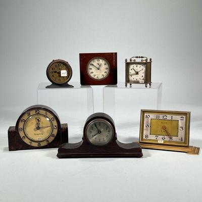 (6pc) MISC. DESK CLOCKS | Including: a Seth Thomas Deft-3 clock, Lux Symphony lucite mantel clock, wooden mantel clock, Elgin 8-day brass...
