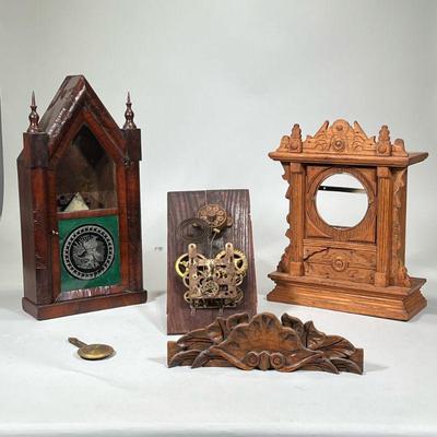 (3pc) CLOCK CASES & PARTS | Including: E. Pluribus Unum decorated clock case, carved wood clock case, and box labeled "Gilbert...