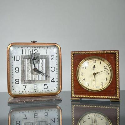 (2pc) SETH THOMAS & INGRAHAM ALARM CLOCKS | Including a Seth Thomas clock in a wood frame, the face with subseconds dial, and an E....