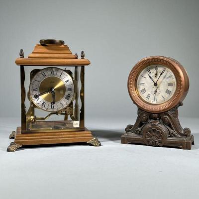 (2pc) MISC. SHELF CLOCKS | Including a Schatz Mantel Carriage clock with 8 chimes, and a round copper & brass American mantel clock...