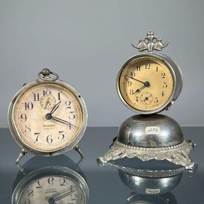 (2pc) SMALL ALARM CLOCKS | Including a bell-form clock, and a Westclox Baby Ben alarm clock, each with subseconds dial. - h. 4.75 x w....