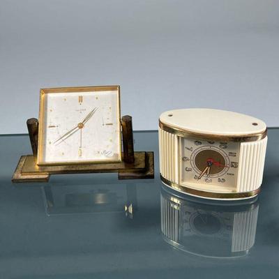 (2pc) TRAVEL / DESK CLOCKS | Including a brass Luxor desk clock of modern design and a Westclox travel clock having a plastic, enamel,...