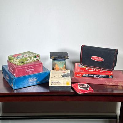 (10pc) BOARD GAMES | Including: Scrabble, travel scrabble, Perquackey, Uno, Deluxe Uno, Mille Bornes, Trivial Pursuit, and Trivial...