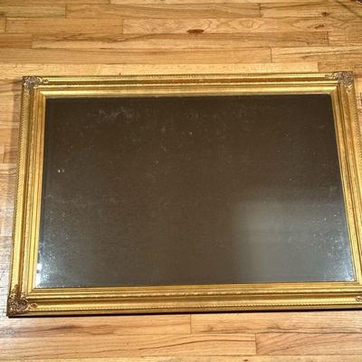 GILT MIRROR | Beveled glass mirror in formed gilt frame. - w. 29.5 x l. 41.5 in

