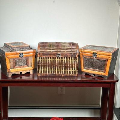 (3pc) DECORATIVE BOXES | Including 2 carved wood & bamboo boxes and 1 wicker box. - h. 12.5 x w. 16 x d. 10 in (largest)

