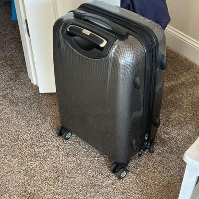 one of two suitcases