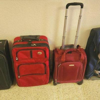 Many apologies, our client removed the Burgundy Suitcase after pics were taken. It is not for sale.