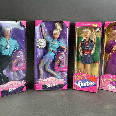 Lot 192 | Four NIB Barbies & A Ken

