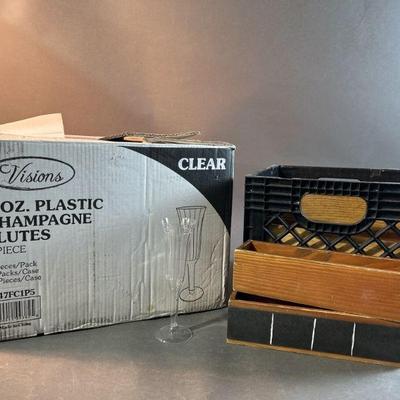 Lot 83 | Bulk Plastic Champane Glasses & Wood Boxes
