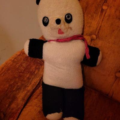 Vintage teddy bear with tumbler inside