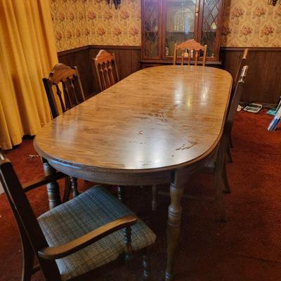Nice table w/6 chairs. Has 2 leaves 8 feet x 40 "