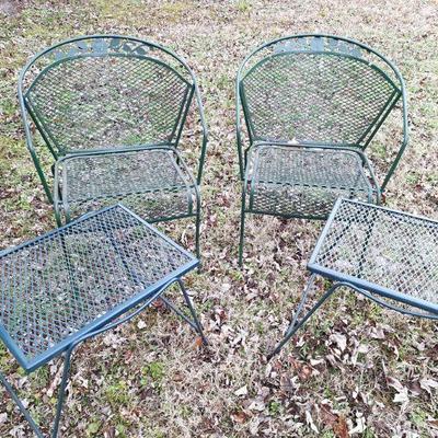 2 iron chairs with side tables