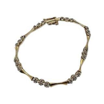 Lot 207
10k Diamond Bracelet Hallmark ZRW L x W: L 19.5cm  W 4mm Clasp: Bracelet Catch Weight: 5.31 gram  (including stones) Estimated...
