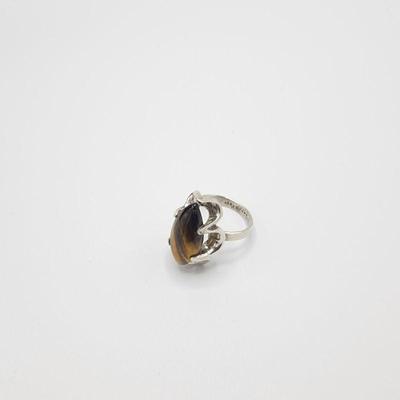 Lot 142
 Tigers Eye Stone Silver Ring Hallmarks: 925 Sz 8.75 Weight: 7.77   Estimated Melt Value: $6.46 as of (01/07/2025 ) Buyer is...