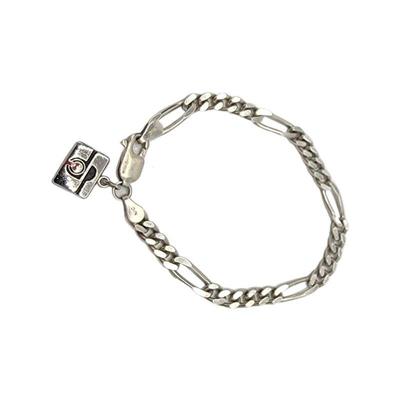  Lot 52
925 Figaro Style Chain Bracelet w/ Charm Hallmark Sterling / Esco L x W: L 18.3cm  W 5mm Clasp: Lobster Claw Weight:10.04 grams...