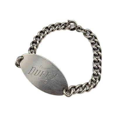 Lot 153
Sterling ID Bracelet Length: 19cm Width:  Chain- 6mm  / Tag-2.2cm Clasp: Claw Clasp Weight:  19.76 grams Estimated Melt Value: $...