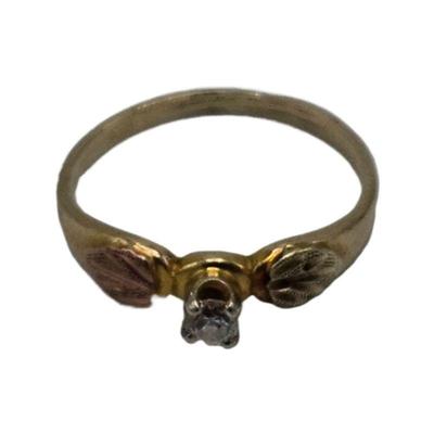 Lot 224
10k Black Hills Gold Leaf Ring w/ Accent Diamond Stone  Sz 2.75 Weight 0.93 grams (includes stone) Hallmark Estimated Melt Value:...