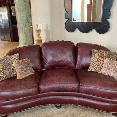 Two identical vintage blackberry leather sofas