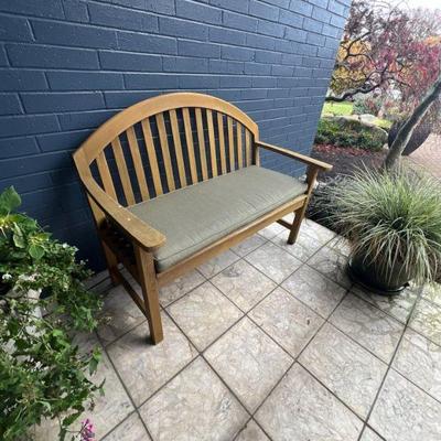 Teak bench and plants