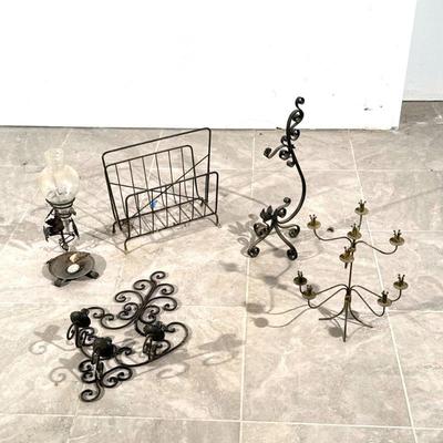 (5pc) IRON AND METAL ITEMS | Including a three-arm wall sconce, a hurricane shade lamp, a magazine rack, and two standing candelabra. -...