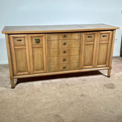 Mid-century Sideboard | American of Martinsville mid-century modern sideboard console cabinet with two bifold cabinet doors centering a...