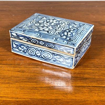 Chinese Blue & White Box | Chinese porcelain rectangular lidded box with key and scroll patterns in under glaze blue, no apparent...