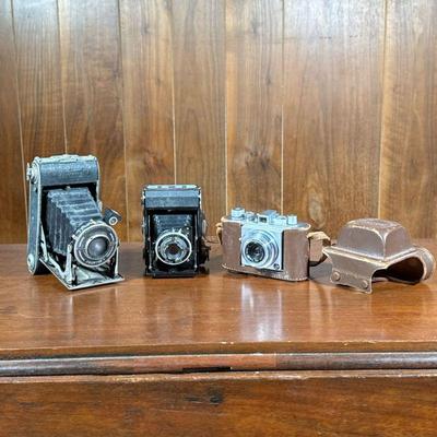 (3pc) Film Cameras | Including a Zeiss Ikon camera, a Primus Prontor II, and an Olympus 35 in leather case.