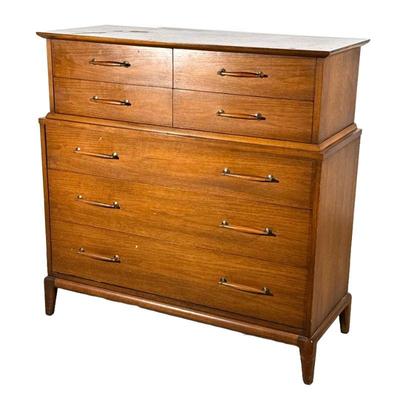 HENDREDON MID-CENTURY TALL CHEST | Mid-century modern dresser having four half-drawers over three full-width drawers, of one-piece...