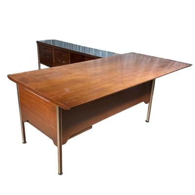 (2pc) MID-CENTURY EXECUTIVE’S CORNER DESK | Mid-century modern desk and sideboard extension, in two pieces, including an executive desk...