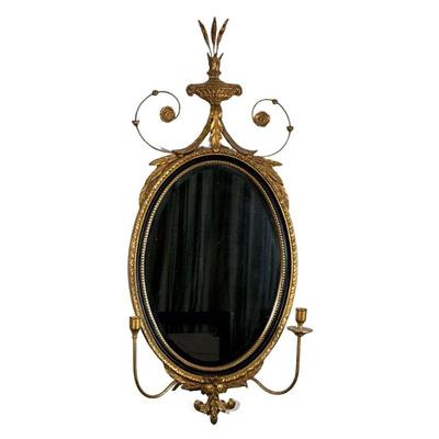 FEDERAL STYLE GILT WALL MIRROR | 20th century, oval mirror with applique decorations and scrollwork, having two candlestick arms. - h. 38...