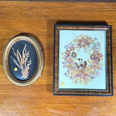 (2pc) Framed Flowers | Including a framed wreath of pressed flowers with butterfly wings and framed plants behind domed glass in a gilt...