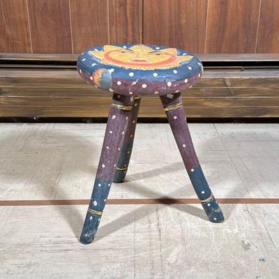 Folk Art Tripod Stool | Carved and polychromed wood, the seat with a sun face, having polka dots on the legs and gilt turnings. - h. 16 x...