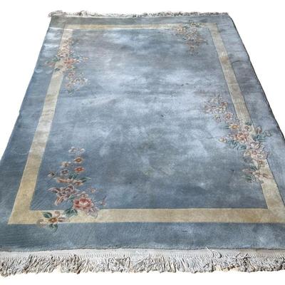BLUE RUG | With floral sprays on a plain light blue ground with cream border. - w. 65 x l. 107 in
