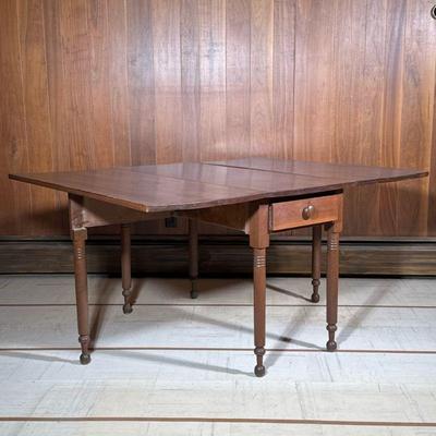 ANTIQUE MAHOGANY DROP LEAF TABLE | Drop leaf extending mahogany table with folding legs and a drawer. - h. 30 x w. 60 x l. 46 in