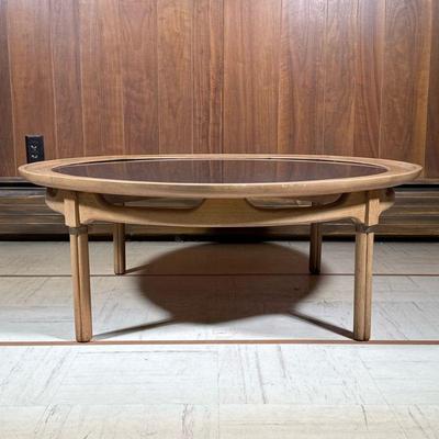 Round Mid-century Coffee Table | Low table with a black inset top in a wood frame. - h. 14.5 x dia. 40.75 in