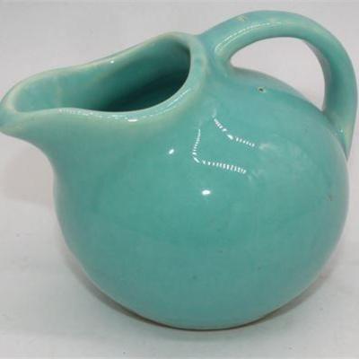 Lot 063   
USA pottery creamer 4 3/4"