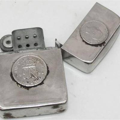 Lot 002  
Silver coin lighter