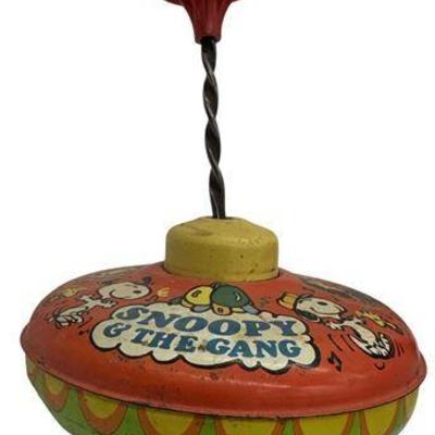 Lot 704   
Vintage “Snoopy And The Gang” Ohio Art Metal Litho Toy Spinning Top