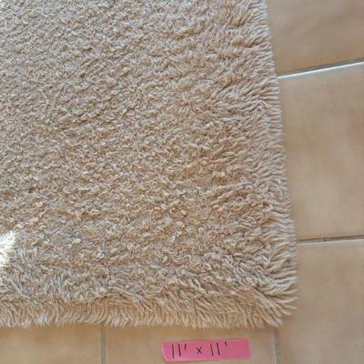 11'x11' cream rug