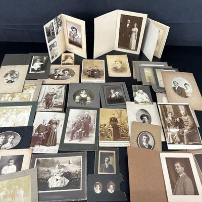 Large group of black and white photos on cardboard mounting set 81