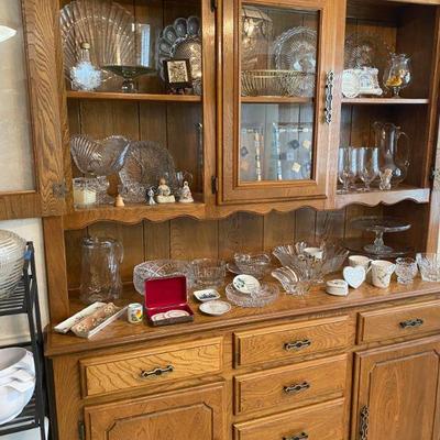 built in hutch loaded with crystal, glass serving pieces, mid century trays, cake plates, bone china and more