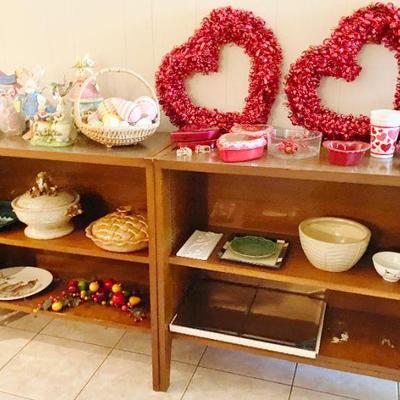 mid century walnut credenza with lots of decoratives on the shelves