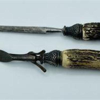 Lot 073   
Antique Bone and Sterling-handled Serving Fork and Knife Sharpener
