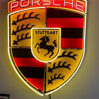Illuminated Neon Porsche Crest (44" x 36" x 8").  With vibrant gold, white, and red neon, the Porsche logo is a...