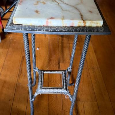 Iron perch with marble top