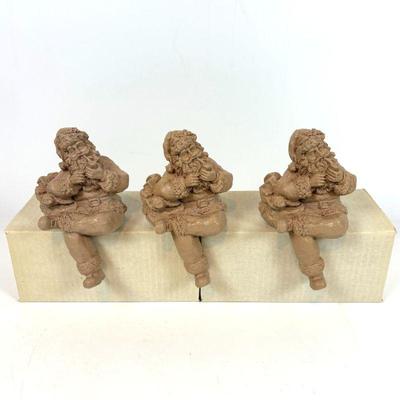Lot #151 - Set of Three Santa Claus Figurines