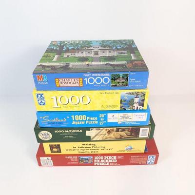 Lot #105 - Lot of 1000 Piece Jigsaw Puzzles - Various Themes, New & Used