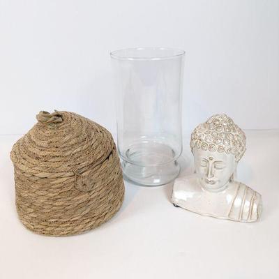 Lot #94 - Decorative Home Accessories Lot - Buddha Head, Glass Vase, and Woven Basket.