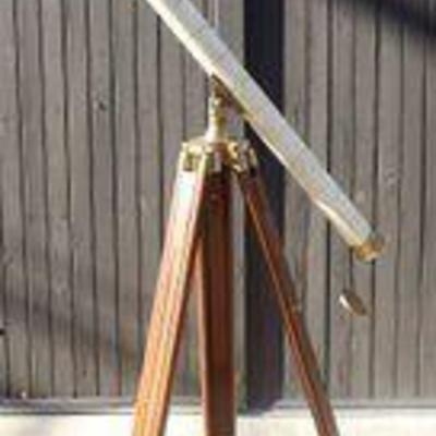 Telescope With White Tiles And Brass Fixtures With Wood Legs