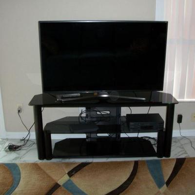Metal with Black glass shelves Media Stand ; 2015 Samsung SUHD Series 7 7000 55in Smart TV with remote and paperwork.